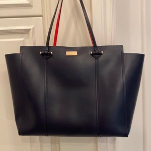 Kate Spade navy leather tote with red leather inside.